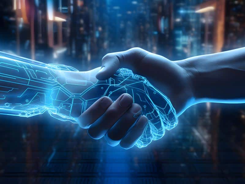 main-robot Une main humaine serre celle d'un robot