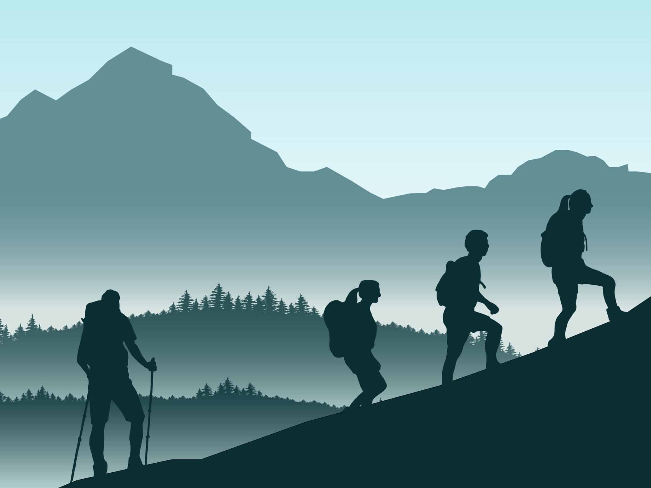 Image de quatre personnes escaladant une montagne.